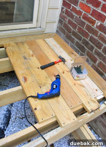Laying the Groundwork for Your Deck 34 First deck boards being installed with a mitered corner design