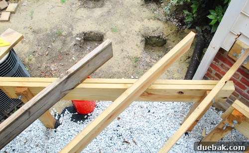 Laying the Groundwork for Your Deck 5 Uneven deck joists extending past the framing line, before band board installation