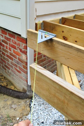 Laying the Groundwork for Your Deck 6 Using a nylon string to mark the cut line for an angled deck joist