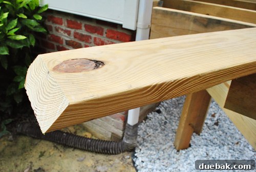 Laying the Groundwork for Your Deck 10 Installing the angled 2x8 band board flush against the house