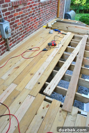 The Foundation of Your Deck 16 Progress shot of the deck at the end of the first day, with several rows of boards laid.