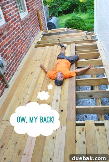 The Foundation of Your Deck 19 The author holding his lower back, indicating pain after an incident.