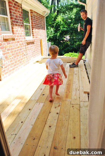 The Foundation of Your Deck 26 Clara, the author's daughter, makes her first playful appearance on the newly laid deck boards.