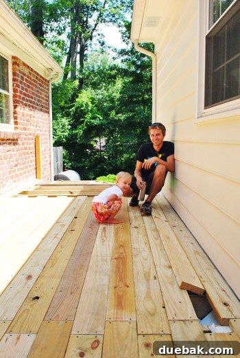 The Foundation of Your Deck 28 Clara smiles, seemingly giving her approval of the deck installation.