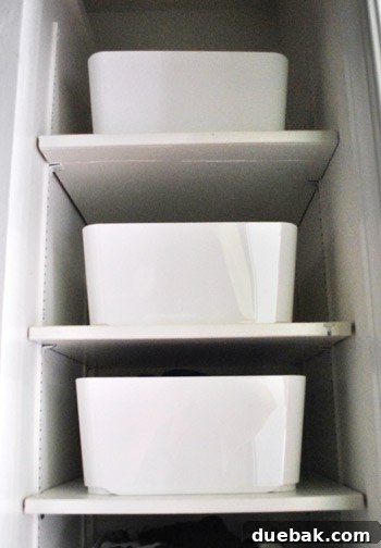 After shot of the closet's upper shelves, now neatly organized with uniform white bins.