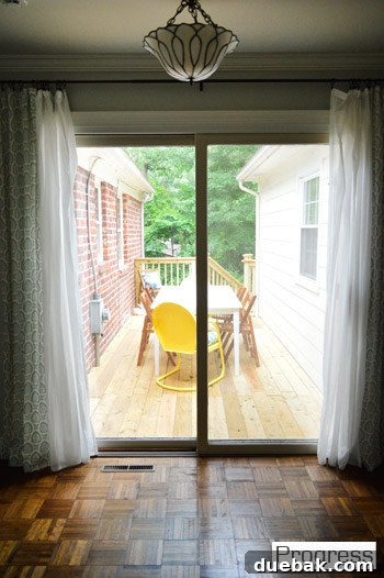My First Home Then and Now: A Year's Perspective 39 Current house deck, custom-built and furnished, offering an elevated outdoor living space.