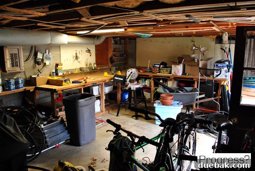 My First Home Then and Now: A Year's Perspective 41 Current house unfinished basement, appearing as a storage area.