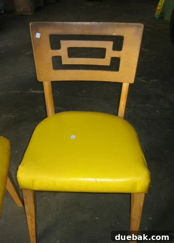 Goodwill Chair Before Makeover Before shot of a vintage wooden dining chair found at Goodwill, showing worn finish and outdated upholstery.