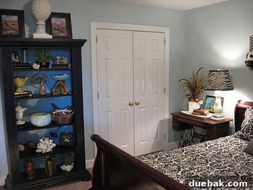 img_3159 After image of a guest room showing a corner with a slipcovered chair and zebra print