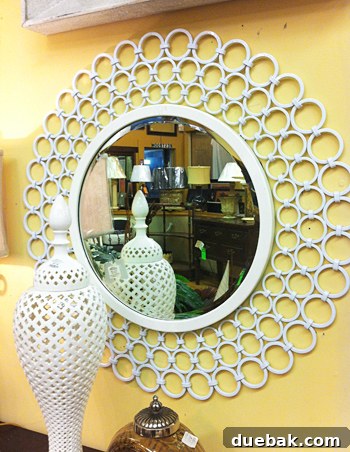 Bridge Views and Verdant Vistas 14 An ornate, orb-patterned headboard at Green Front Furniture