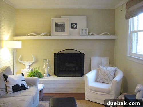 family-room-before-and-after Ceramic horns on fireplace mantel