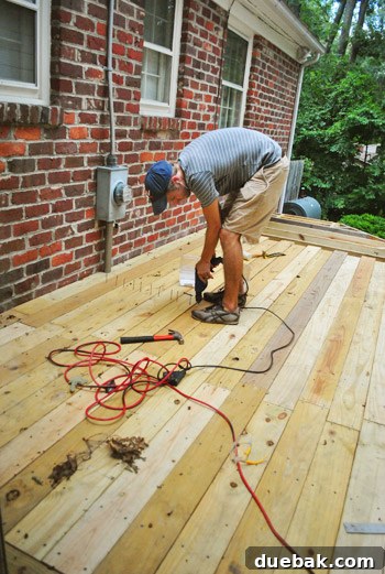 Crafting Your Perfect Outdoor Deck 2 Deck's middle section with boards laid and screwed into place.