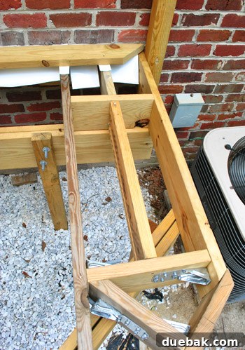 Crafting Your Perfect Outdoor Deck 4 Deck boards extending beyond the edge, awaiting trimming.