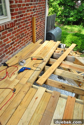 Crafting Your Perfect Outdoor Deck 5 Jagged edge of deck boards before trimming.