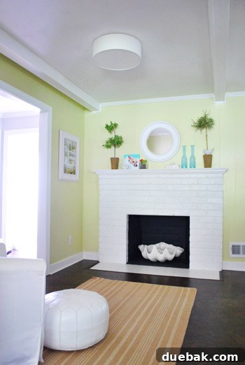 Mirroring Elegance Above the Mantel 2 Comically small mirror above a fireplace mantel, indicating a need for an upgrade.