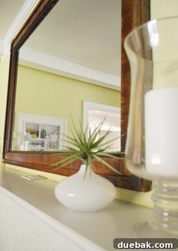 Mirroring Elegance Above the Mantel 11 A closer look at the large mirror, demonstrating its visual impact.