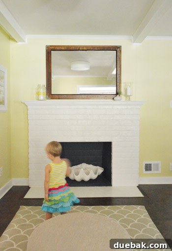 Mirroring Elegance Above the Mantel 13 Clara standing in front of the new mirror, a charming photo bomb.