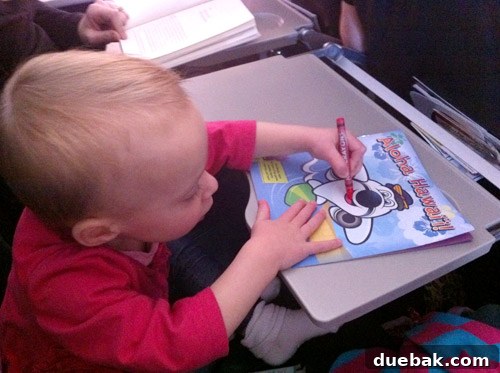 A Parent's Playbook for Flying with Toddlers 4 flying with toddler coloring on airplane tray