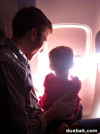 A Parent's Playbook for Flying with Toddlers 7 flying with toddler looking out the window