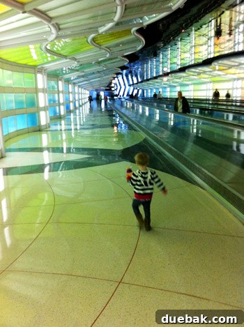 A Parent's Playbook for Flying with Toddlers 8 flying with toddler playing in the airport with cool lights