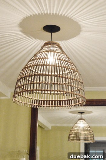 Woven Light: Create Your Own Basket Pendant 20 DIY basket pendant light illuminated with a clear bulb, showing light patterns