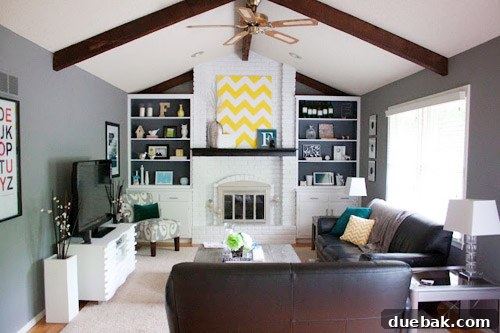 Close-up of the freshly painted white brick fireplace with a sleek modern finish