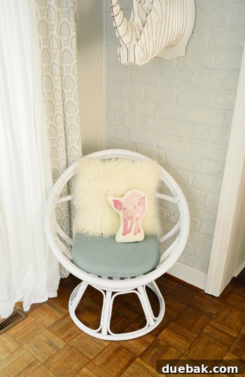 The Rise of the Egg Chair 13 The egg chair with the final choice of back pillows: a rhino and a pig-themed pillow.