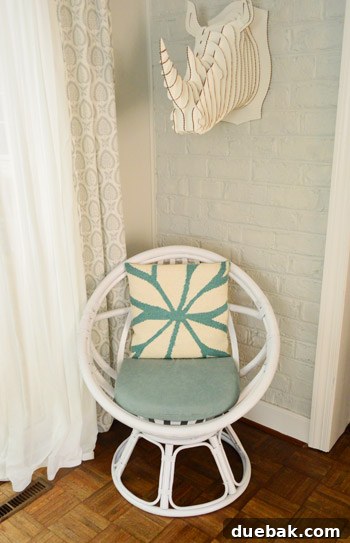 The Rise of the Egg Chair 10 The egg chair styled with a blue and white patterned back pillow.