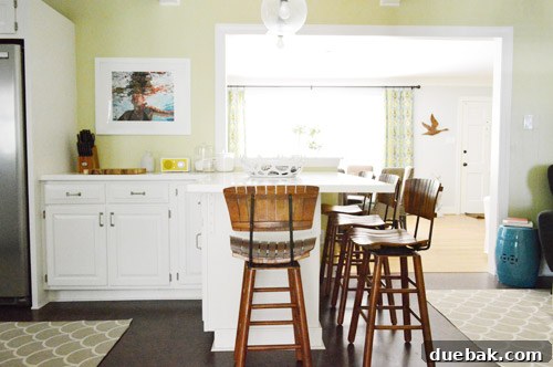 Kitchen Charm: Vintage Wood Stool Finds 8 View of the swivel mechanism and dark iron hardware on the vintage stools