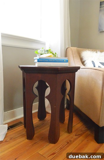 Close-up of the Moroccan accent table's legs and the rug beneath, highlighting the subtle pattern match