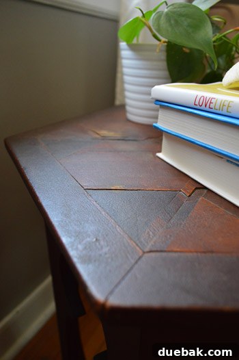Extremely close-up shot of the ornate carved wooden top of the Moroccan accent table, showcasing intricate details
