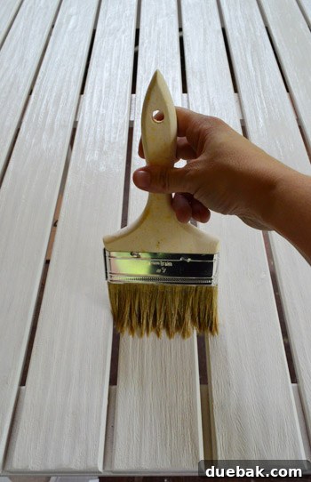 The Outdoor Furniture Secret: Varnish and Teak Oil for Enduring Beauty 5 Applying water-based polyurethane to an outdoor table leg