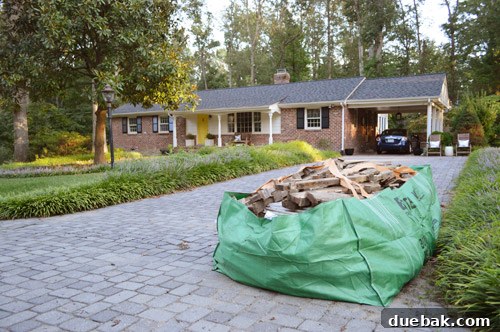 Full Bagster on the driveway with a house in the background