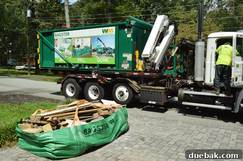Waste Management truck arriving for Bagster pickup