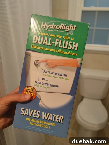 Close-up of a new dual flush toilet kit's components, indicating readiness for installation.