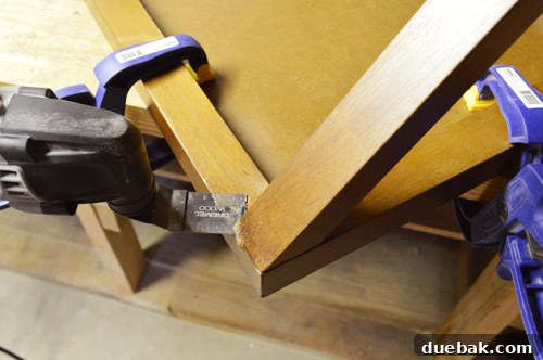 Using a Dremel to cut off the tabletop from the base