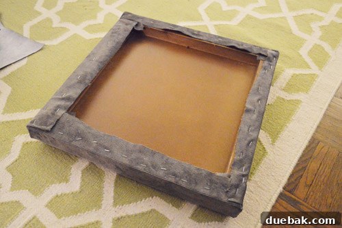 Initial stapling of fabric to the underside of the tabletop