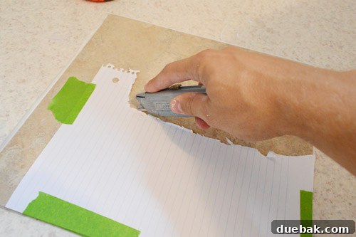 Cutting vinyl tile using a paper template