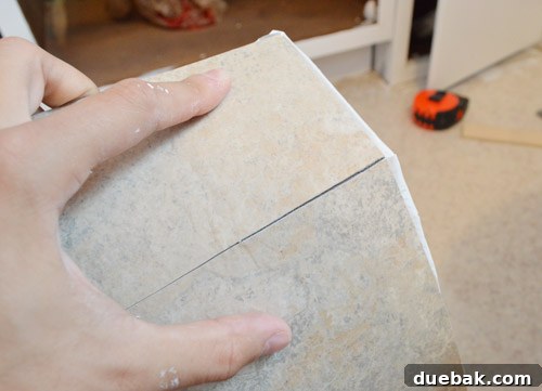 Demonstrating cutting vinyl tiles