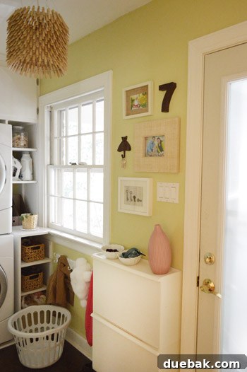 Close-up of a metal number '7' hanging on a wall, part of a gallery wall with personalized decor.
