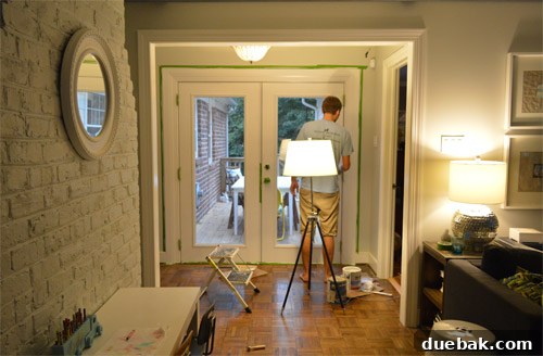 Close-up of newly painted French doors, interior side, showcasing a smooth white finish and crisp lines.