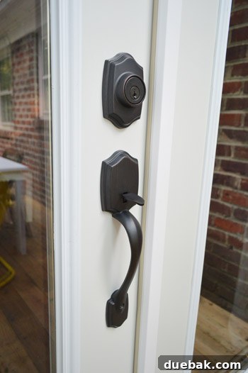 Close-up of the elegant oil-rubbed bronze (ORB) door hardware on the new French doors.
