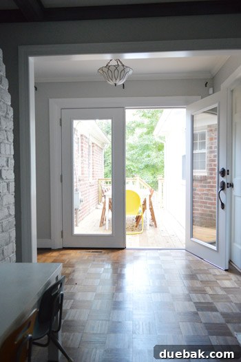 One French door opened for everyday use, demonstrating practical functionality and ease of access.