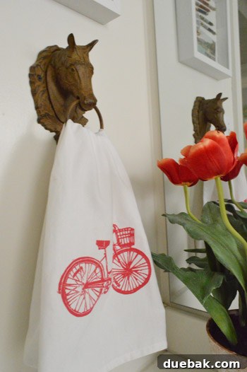 Preserving Memories in Shadow Box Frames 11 Cute bike-themed hand towel hanging in a bathroom