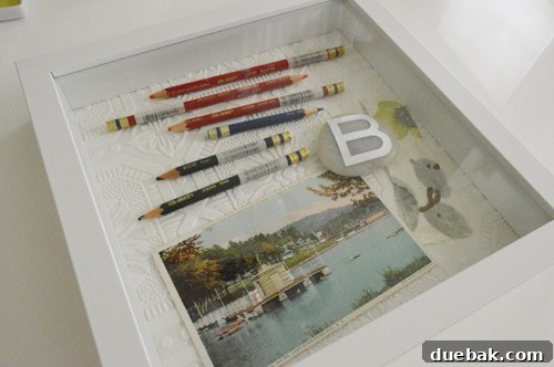 Preserving Memories in Shadow Box Frames 9 Shadowbox background with items glued, ready for framing