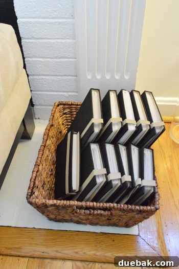 Neatly organized photo albums on a shelf.