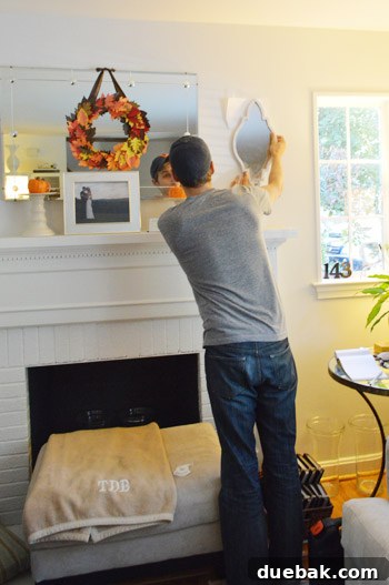 Cat, happy with the installed candle sconces on her living room wall.