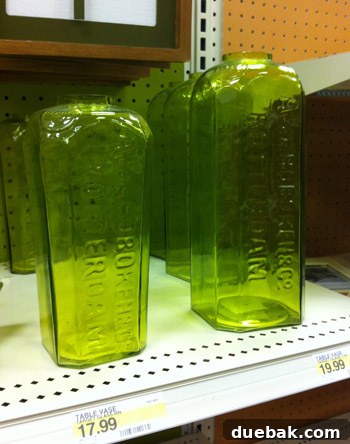 Rustic green glass vases with embossed letters, perfect for modern-industrial home decor