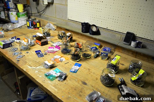 Maximize Tool Storage with a Pegboard 13 Screws and nails sorted on table into groups