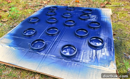 Maximize Tool Storage with a Pegboard 14 Mason jars with blue lids for hardware storage